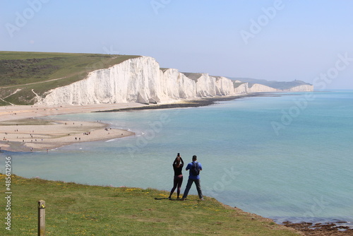 Tourists taking pictures at Seven Sister Cliff Walk (England)
