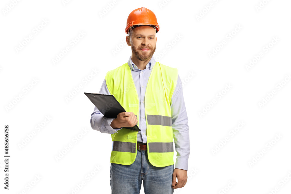 Young male engineer with a hardhat holding a clipboard Young male engineer with a hardhat holding a clipboard