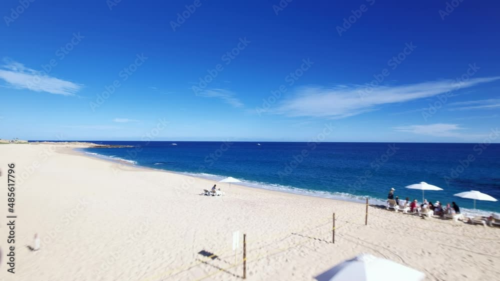 Cabo San Lucas Mexico, aerial drone over blue infinity pool flying to beach Cabo San Lucas Mexico, aerial drone over blue infinity pool flying to beach