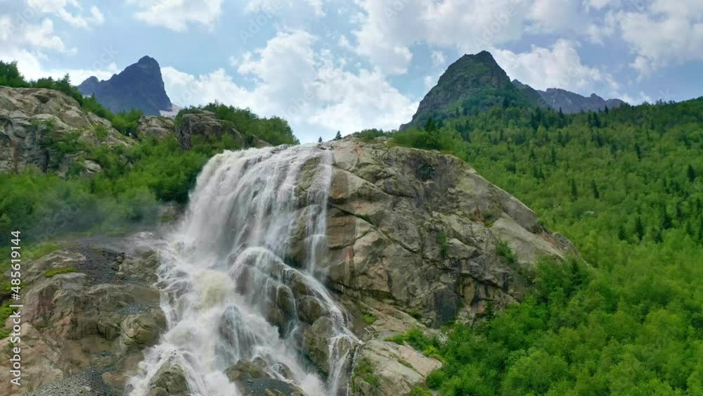 Beautiful mountain river and waterfall in valley. Aerial nature landscape. Beautiful mountain river and waterfall in valley. Aerial nature landscape.