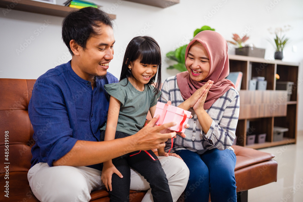muslim family get new suprise present and open it together muslim family get new suprise present and open it together