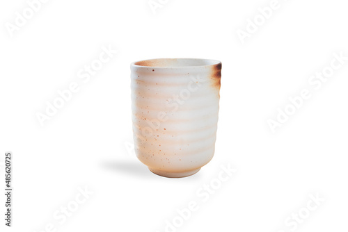 Isolated image of a white pottery coffee mug with a white background and a shadow of the glass, suitable for use in beverages or home decor.