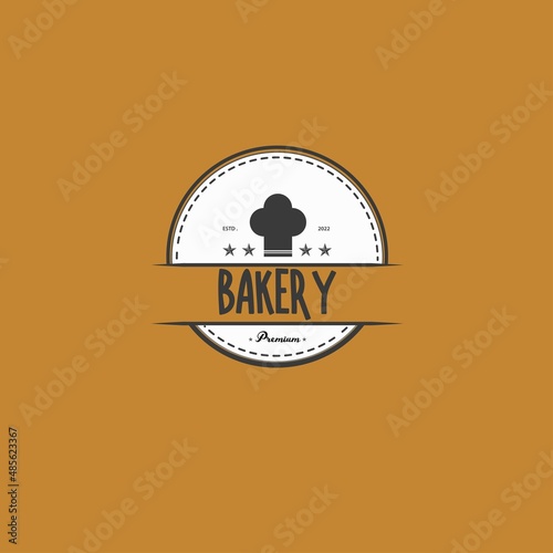 simple vintage bakery logo, with a yellow background and a brown logo, suitable for any content.