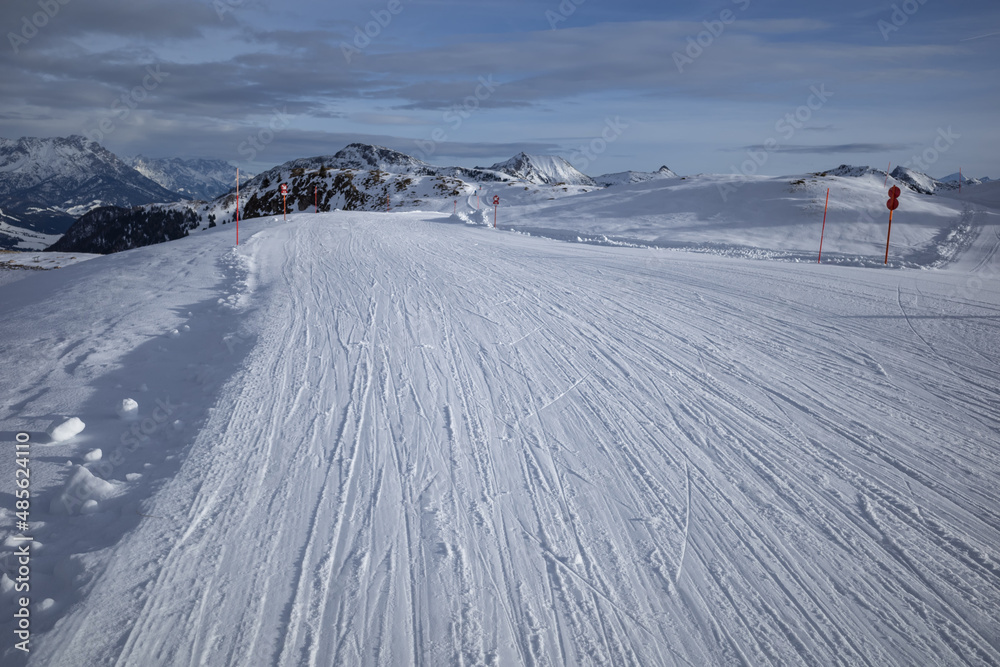 Kirchberg, Austria - December 26, 2021: Ski resort Kitzski in the Alps. Mountain snow peaks, skiers in equipment