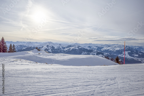 Obraz na płótnie Kirchberg, Austria - December 26, 2021: Ski resort Kitzski in the Alps. Mountain snow peaks, skiers in equipment w salonie