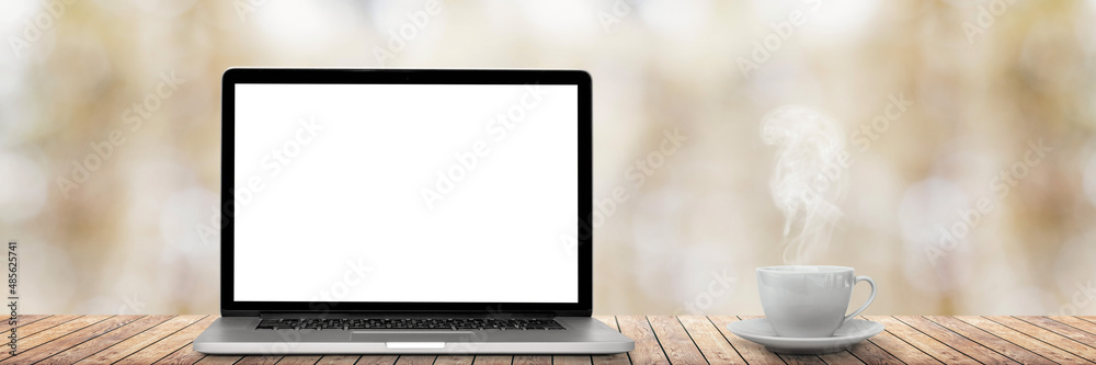 Obraz premium the modern laptop and coffee in the office on the window backgrounds