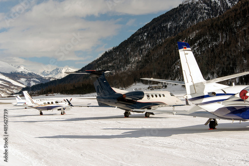 Private jets and aircrafts in the airport of Engadine St Moritz in winter time