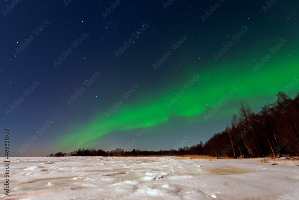 Aurora borealis green-purple on a clear winter night