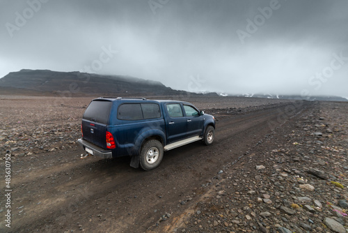 Blue SUV car driving in highlands Iceland view over the car hood © DBA
