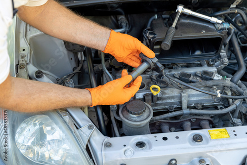 Εκτύπωση καμβά Ignition or spark coil replacement. Repairing of vehicle.