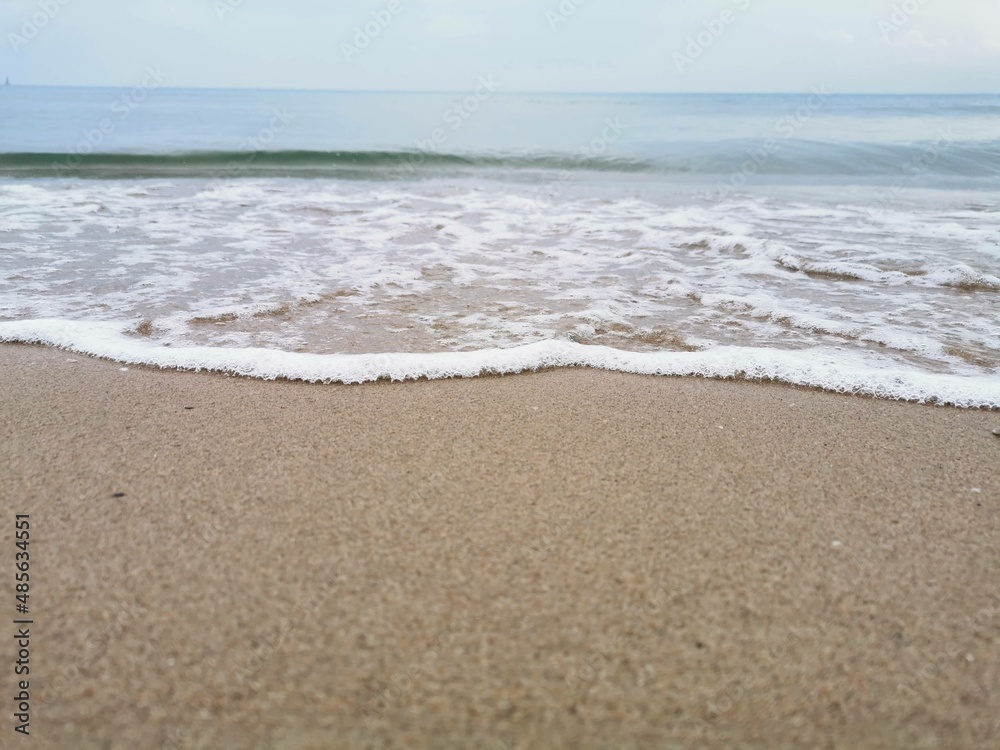 Detail of small waves arriving at the shore of the beach. Relaxation and peace Detail of small waves arriving at the shore of the beach. Relaxation and peace