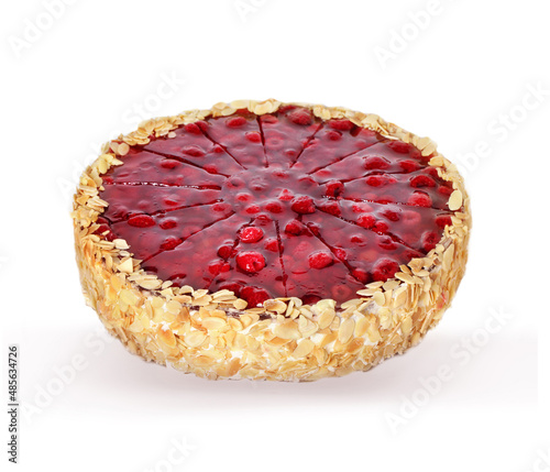 Red fruit sponge cake on white background.