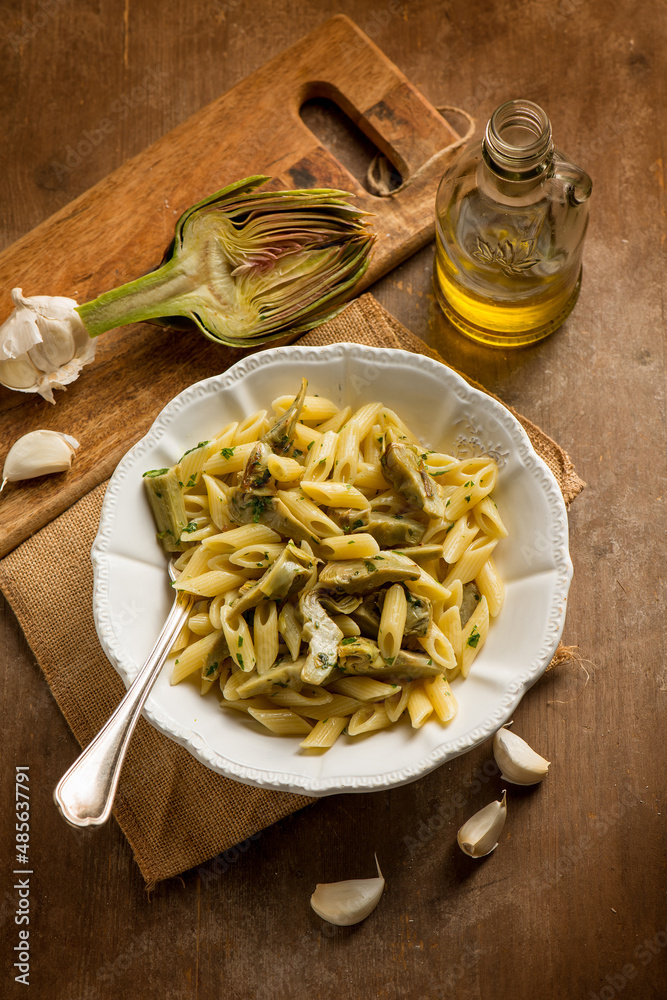 Fototapeta premium pasta with sauteed artichoke garlic and olive oil
