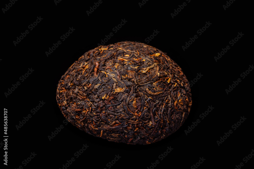 chinese puerh tea on black background close-up chinese puerh tea on black background close-up