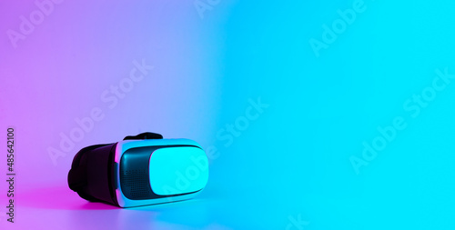 VR headset virtual reality. 3d digital glasses on futuristic neon tech background. Innovation device, cyberspace technology.