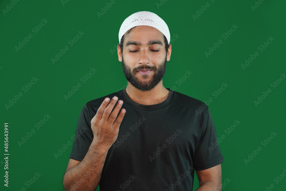 muslim boy man praying on Green screen background. muslim boy man praying on Green screen background.