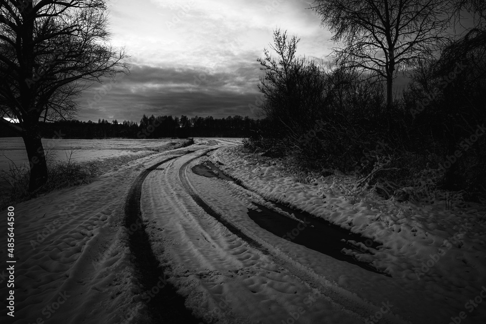 rarely used dirt road in Latvia countryside, slippery, dangerous winding country road rarely used dirt road in Latvia countryside, slippery, dangerous winding country road