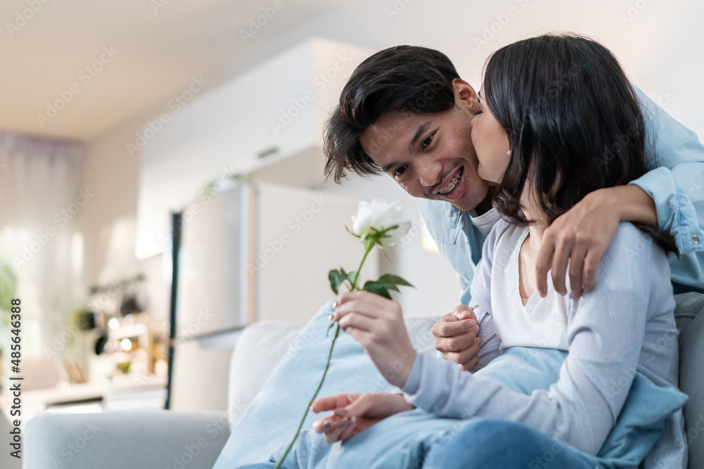Asian young man surprise and give rose flower to beautiful girlfriend. Asian young man surprise and give rose flower to beautiful girlfriend.