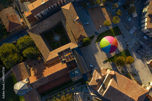 Aerial view of a hot ai balloon in Monestir square near Santa Maria de Ripoll monastery in Girona, Spain. photo