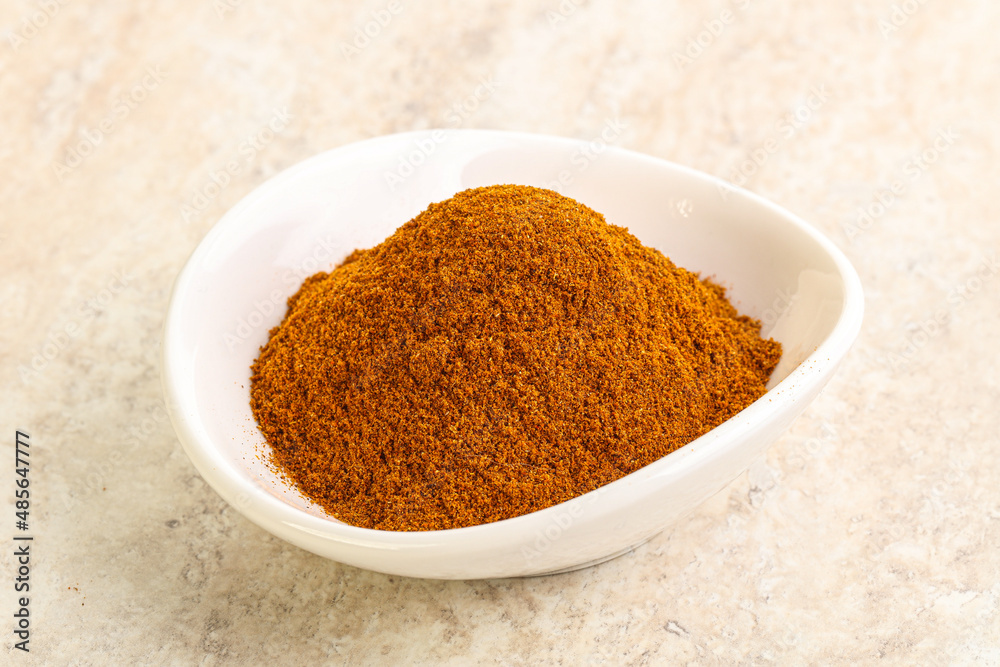 Dry Paprika powder in the bowl Dry Paprika powder in the bowl