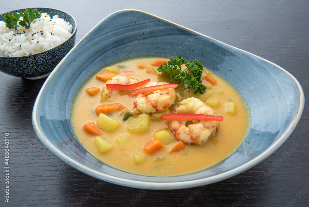 Thai Yellow Curry soup, Coconut milk soup with king size prawns, potatoes, carrots, onion, green beans and a side of Thai Jasmine rice. Thai Yellow Curry soup, Coconut milk soup with king size prawns, potatoes, carrots, onion, green beans and a side of Thai Jasmine rice.