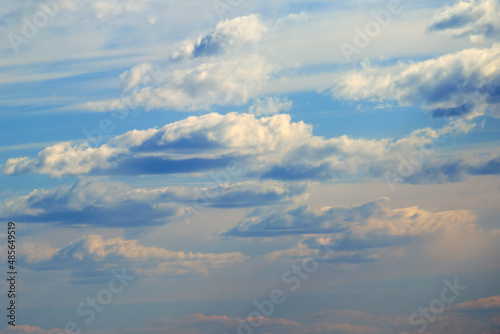 White clouds on a soft daytime sky, cloudscape
