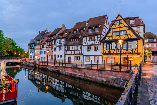 Sightseeing of France. Amazing colorful traditional half timbered houses in Colmar old town, beautiful night view, Colmar, Alsace, France