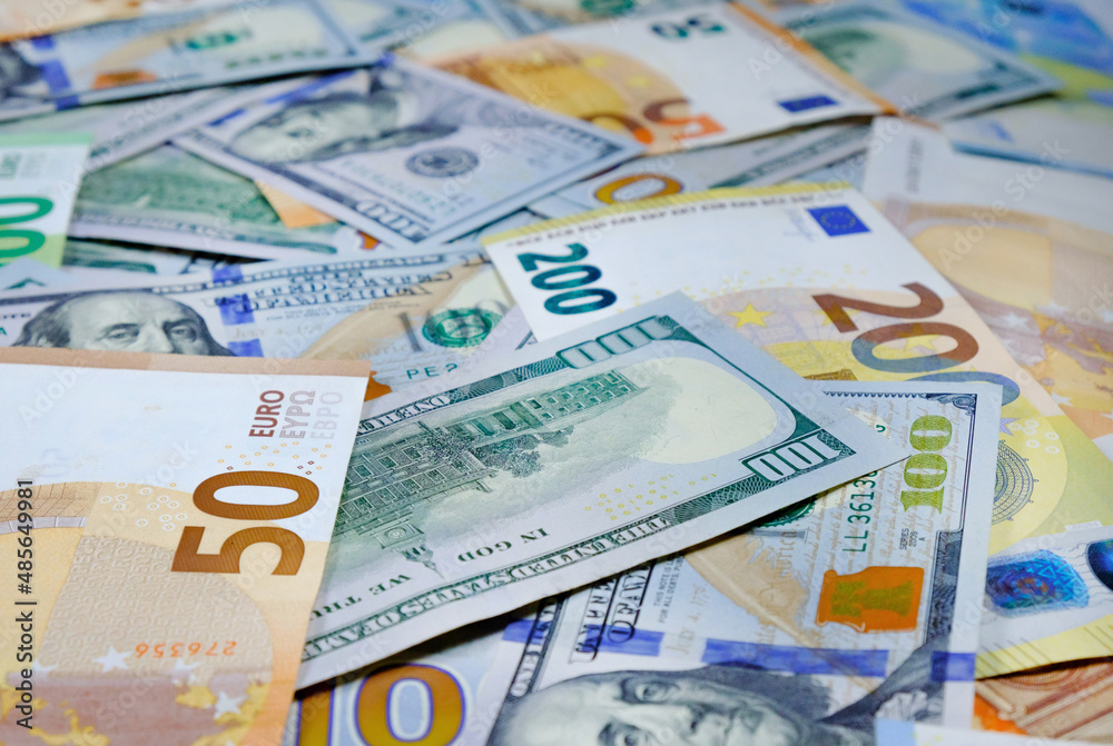 Money. Euro and us dollars banknotes. Background of dollars and european currency Money. Euro and us dollars banknotes. Background of dollars and european currency
