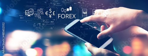 Photos Forex trading concept with blurred city lights at night