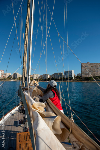 Adult Woman Pulling Rope on Sailboat , Alicante, Costa Blanca, Spain © Amaiquez
