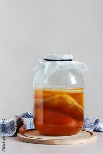 kombucha in a jar on the table. photo