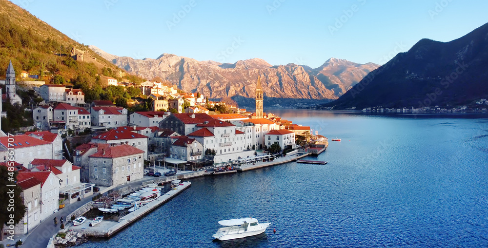 Panoramic sunset aerial drone view of the ancient city of Perast, Montenegro.