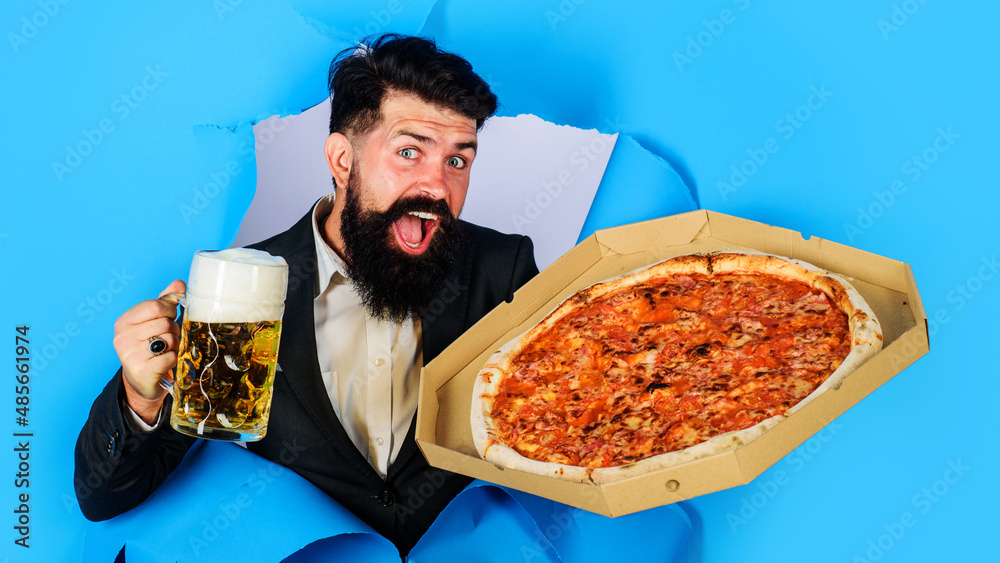 Bearded man with delicious pizza and cold beer. Italian food. Pizza delivery concept.