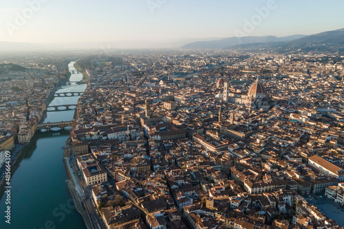 Aerial view of Santa Maria del Fiore and Piazza della Signoria, two famous landmark in Florence downtown along Arno river, Tuscany, Italy. photo