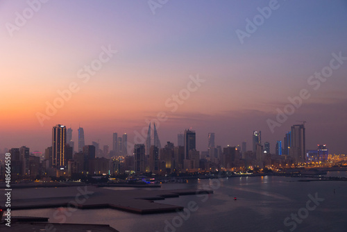 Manama city skyline at sunset in the Gulf country of Bahrain 