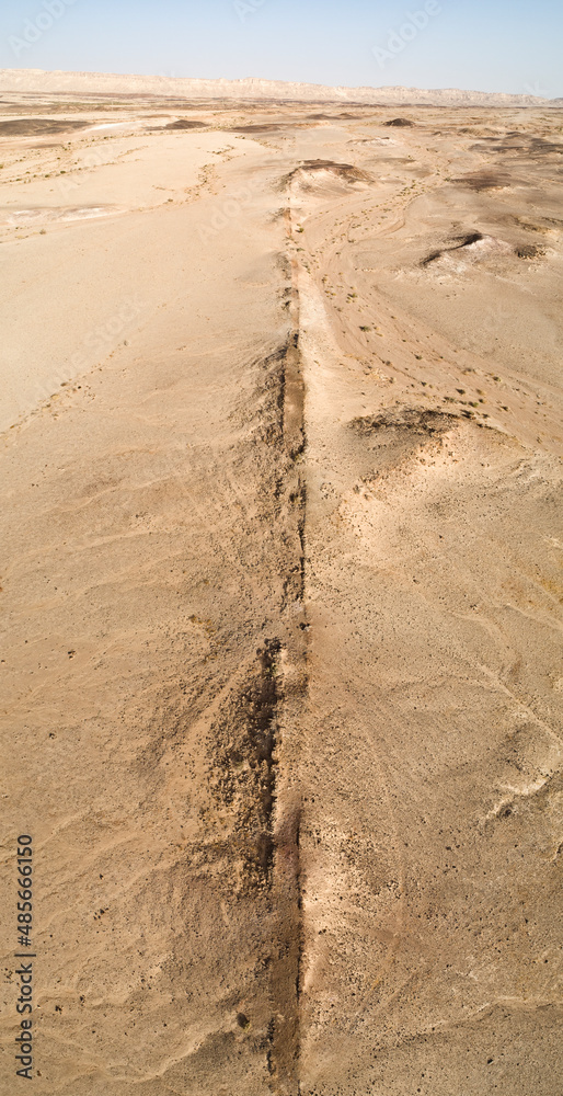 Panoramic aerial view of a desert valley near Ramon crater, Negev, Israel. Panoramic aerial view of a desert valley near Ramon crater, Negev, Israel.