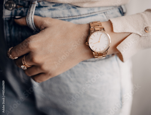 Beautiful stylish elegant white watch on woman hand. Close up photo.