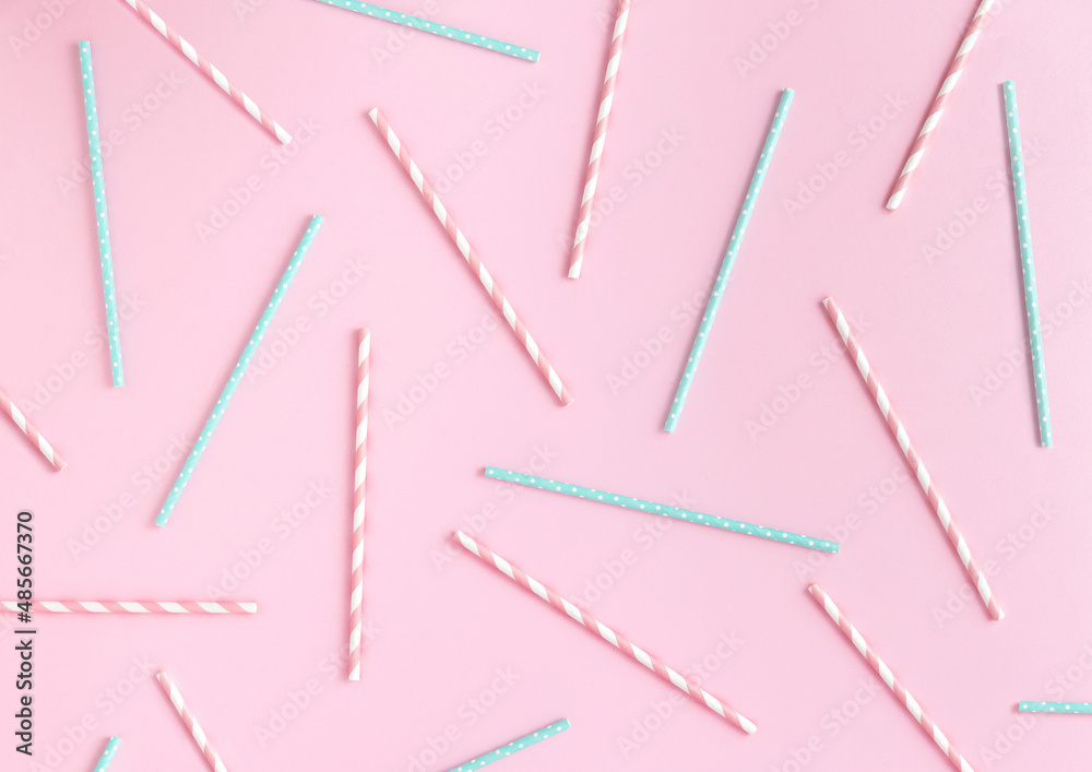 Retro pastel drinking paper straws pattern on pink background. Flat lay