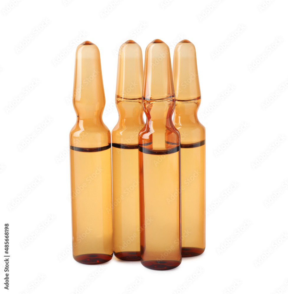 Brown pharmaceutical ampoules with medication on white background Brown pharmaceutical ampoules with medication on white background