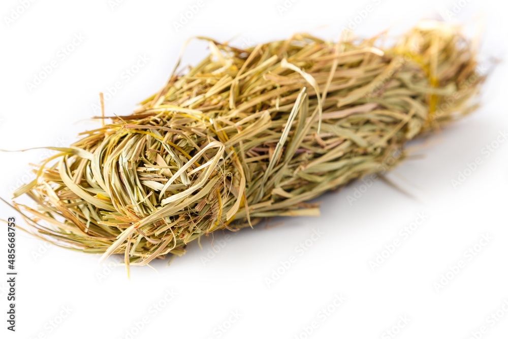 Bunch of dry lemongrass grass on a white background. Bunch of dry lemongrass grass on a white background.