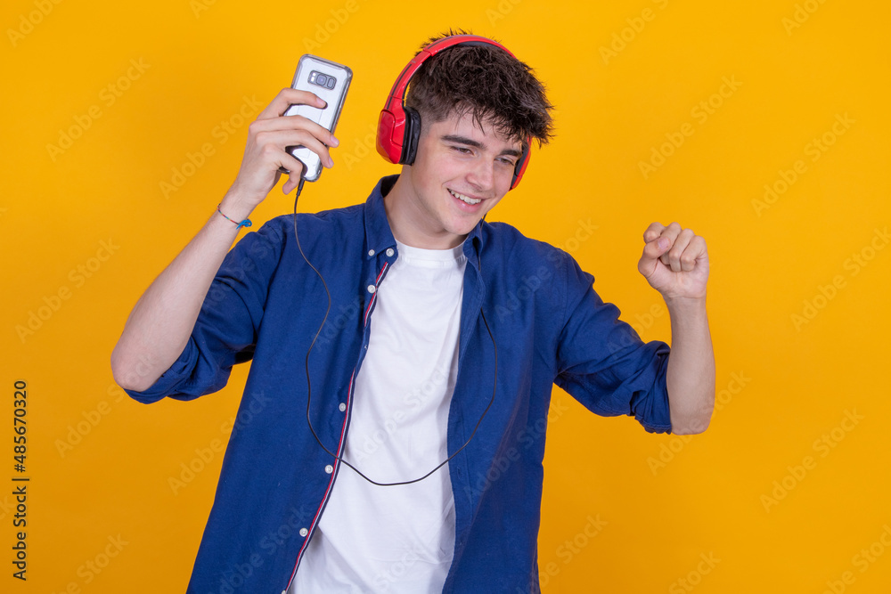 teenager with headphones isolated dancing teenager with headphones isolated dancing