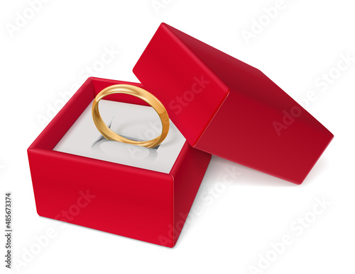 Golden ring in red jewelry gift box.