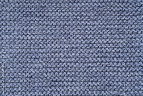 Obraz na płótnie Blue knitted texture of a scarf or winter sweater.