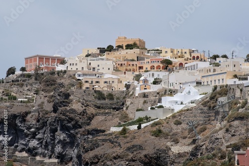 Panoramic view of the picturesque villas with balcony of the village of Fira in Santorini Greece