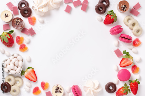 Valentines day background frame with pink and chocolate sweets, copy space