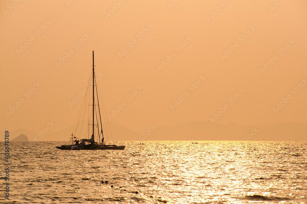 Catamaran Silhouetted at Sunrise off East Railay Beach (Rai Leh), South Thailand, Southeast Asia