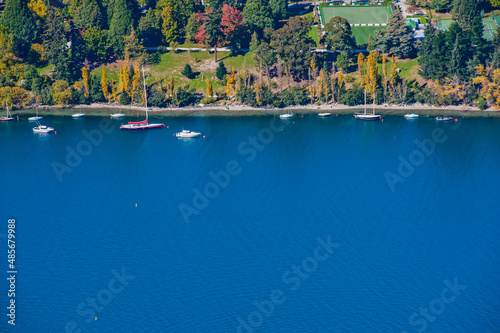 Boats moored up in Queenstown Harbour, South Island, New Zealand