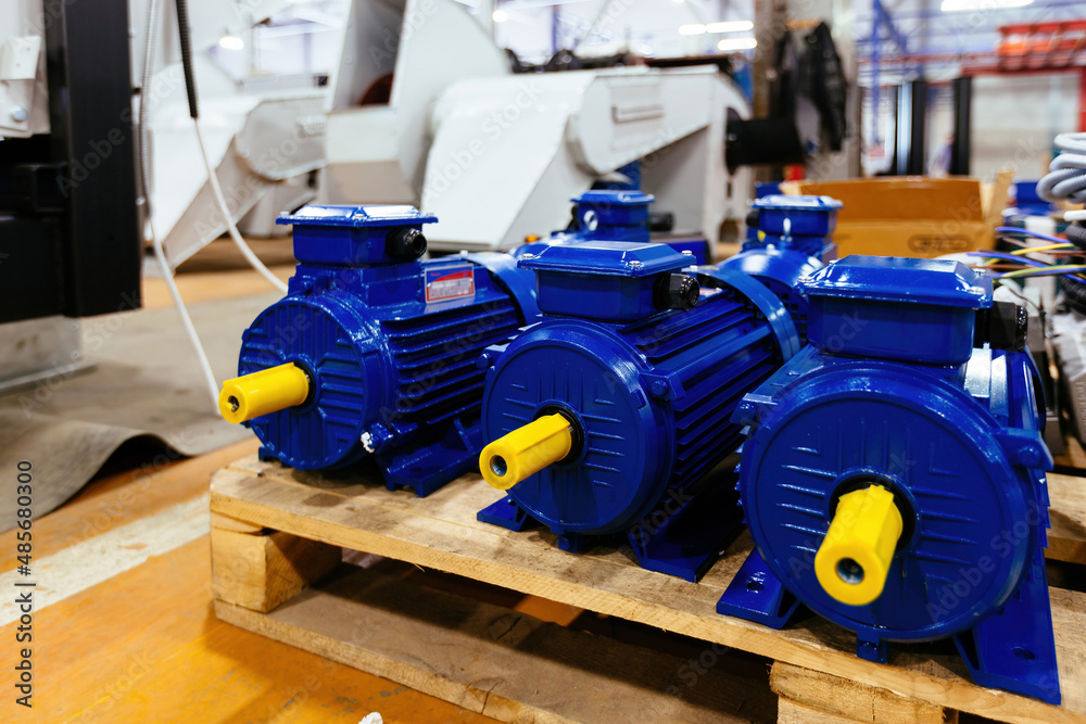 New blue electric motors in the factory for assembling New blue electric motors in the factory for assembling