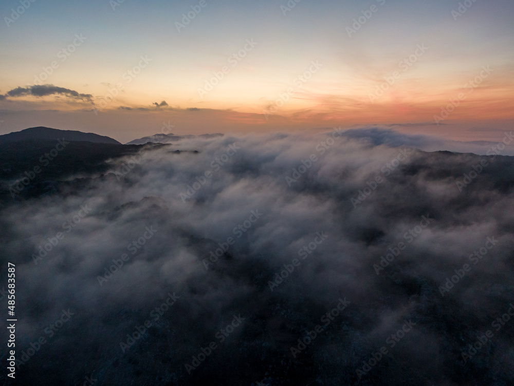 Aerial droen view of beautiful clouds with sunset  in mountain
