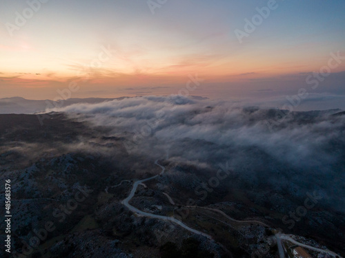 Aerial droen view of beautiful clouds with sunset in mountain